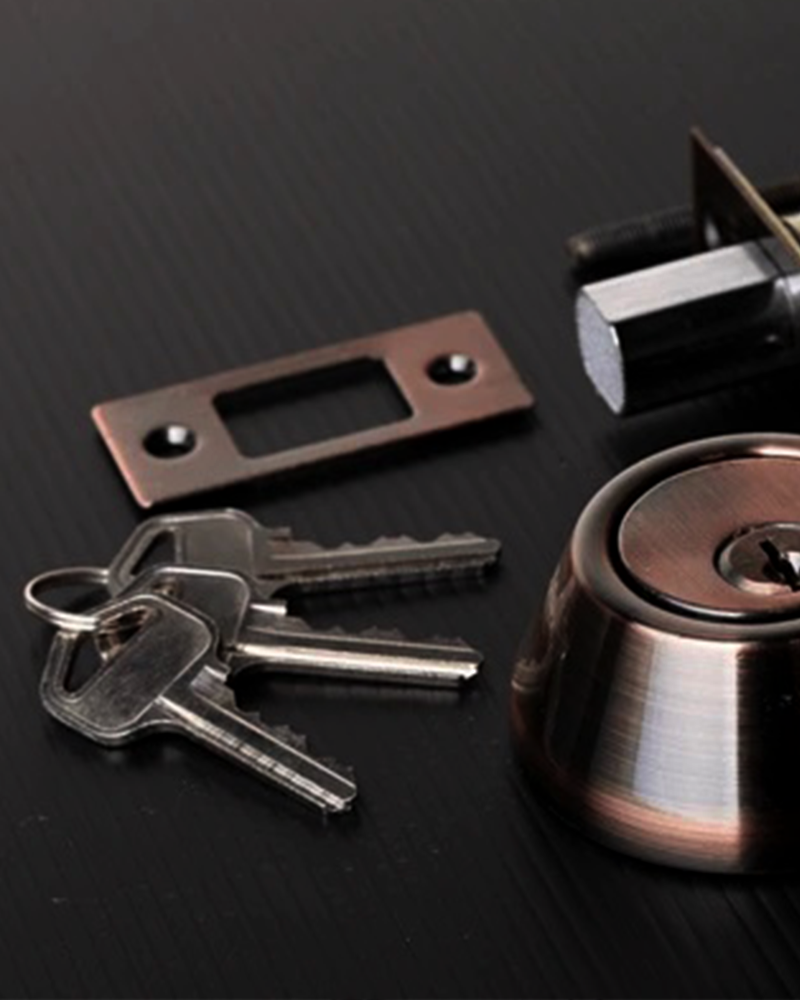 Locksmith upgrading home security with deadbolt lock installation